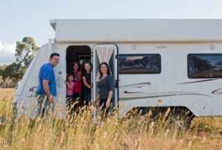 Happy family in a caravan