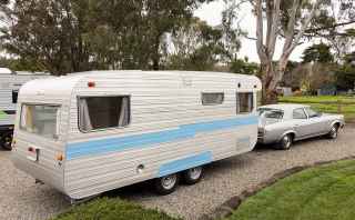 Car and caravan parked in the camping ground