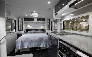 Interior of a caravan with a modern black and white design