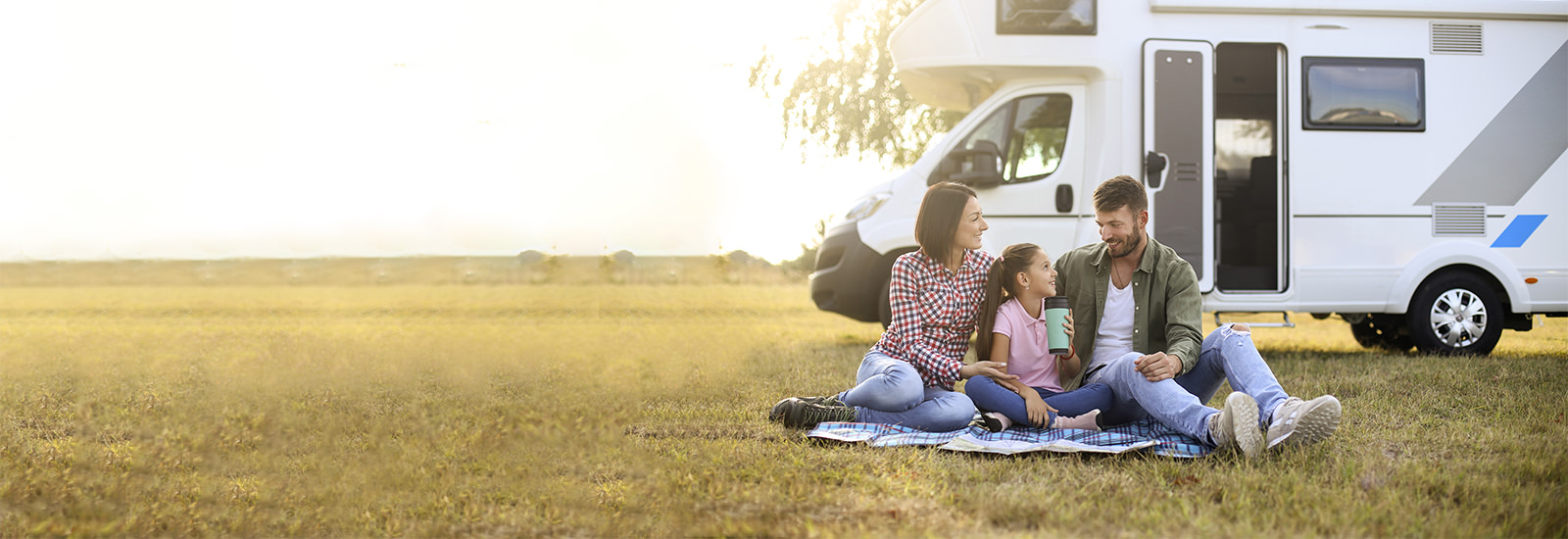 A family is in a recreational vehicle.